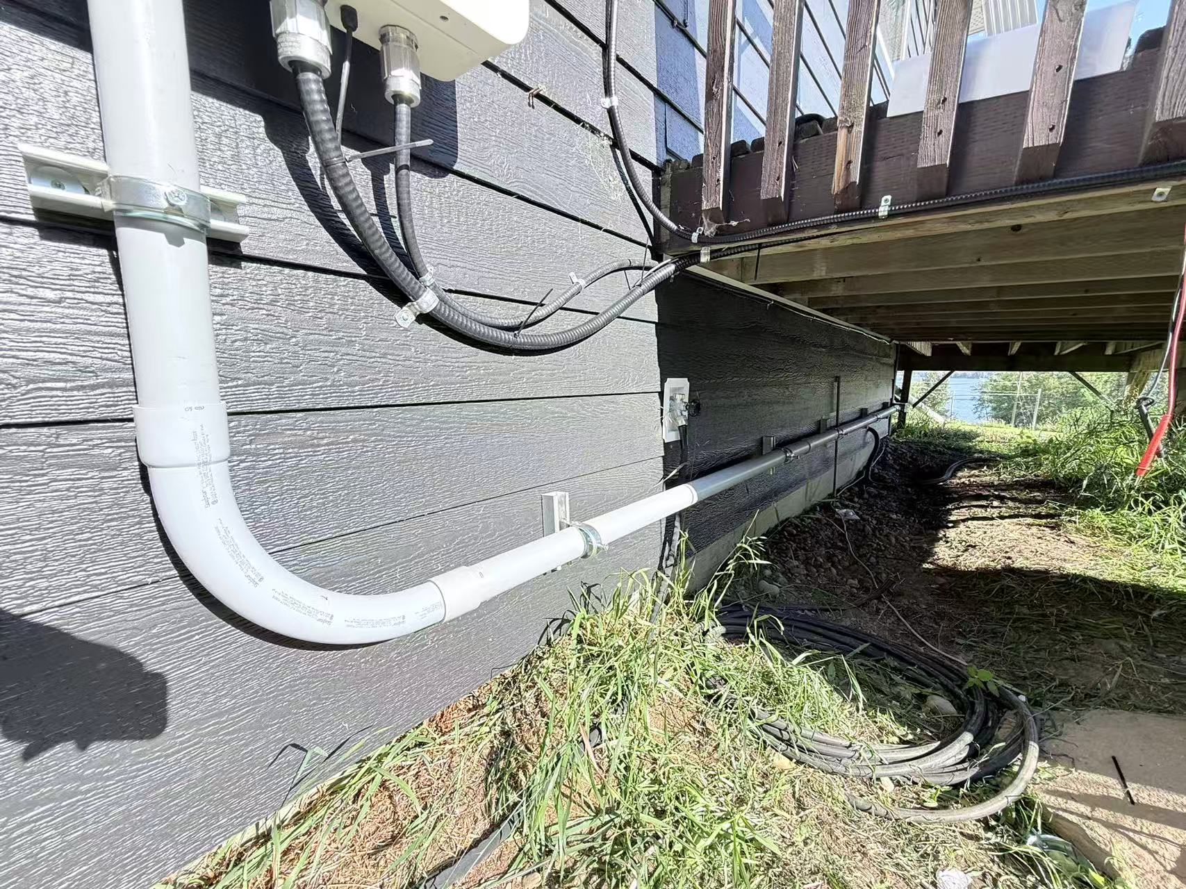 Close view of conduit and an exterior electrical connection