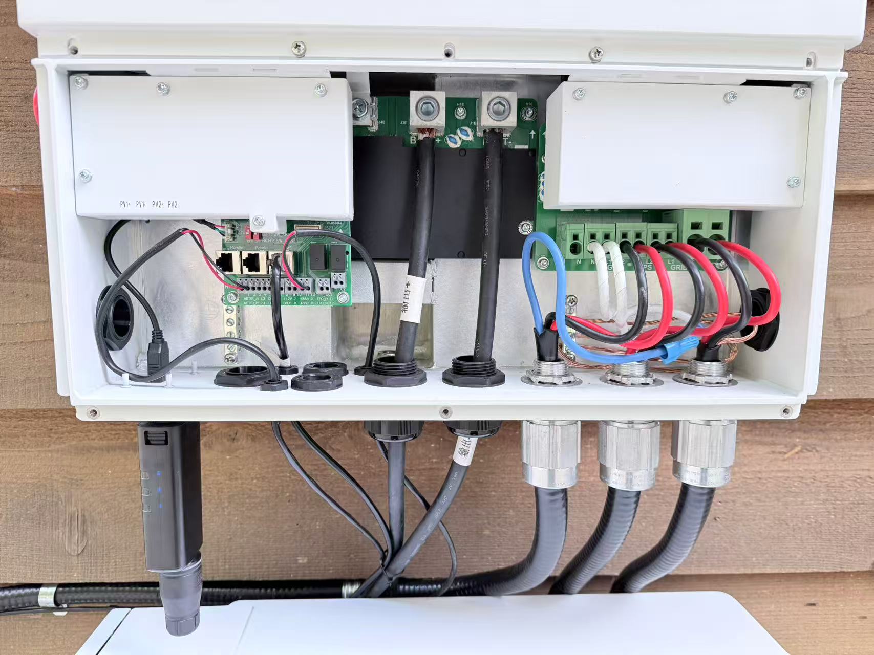 Open electrical box showing interior wiring and components