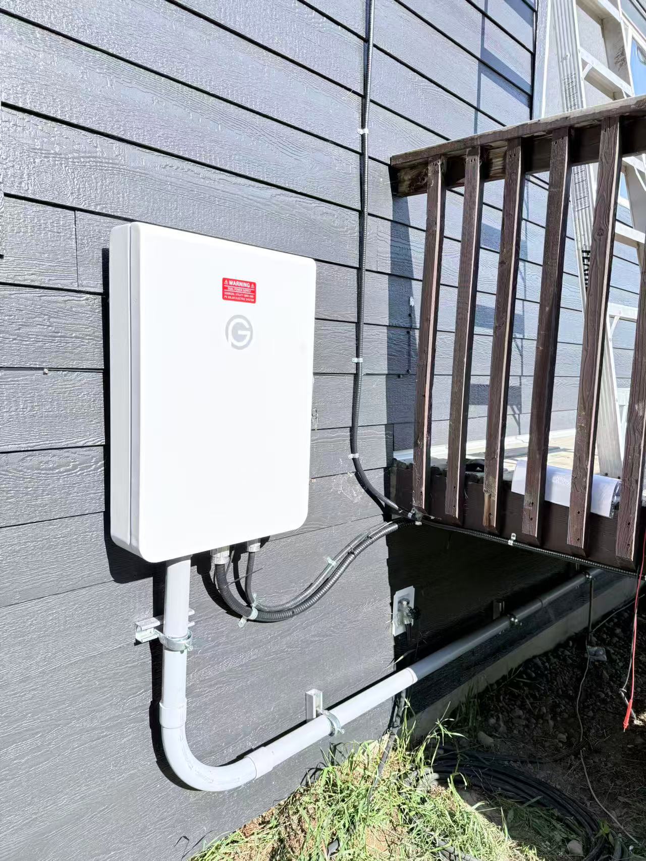 Close view of an exterior disconnect switch and conduit wiring