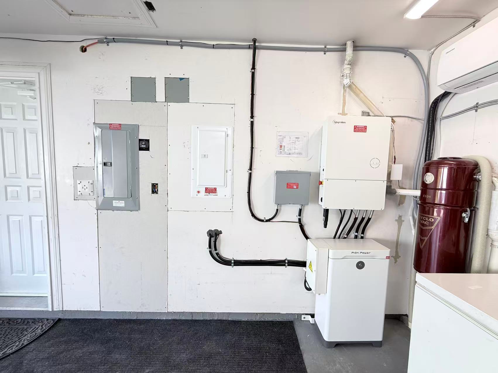 Hoymiles inverter and Pion Power battery equipment installed inside a garage