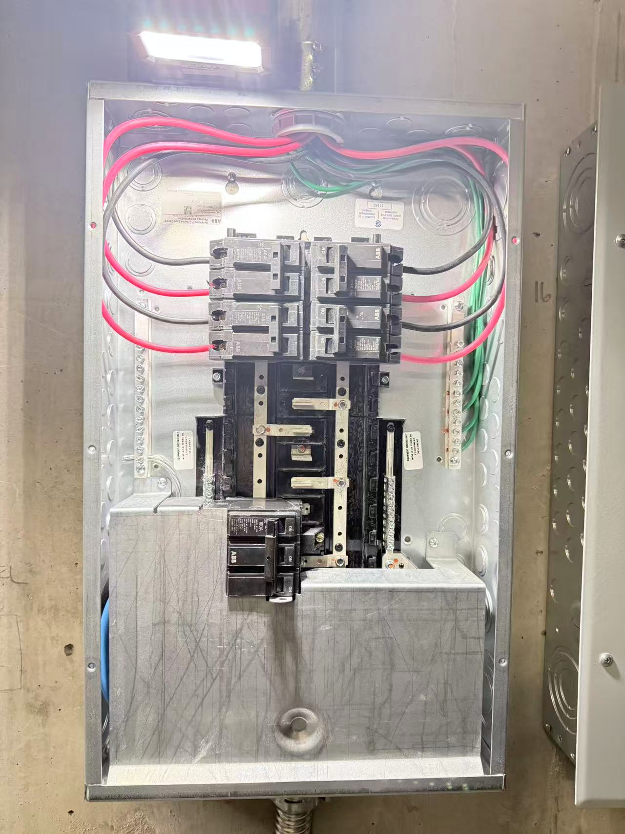Close view of breakers inside an electrical panel